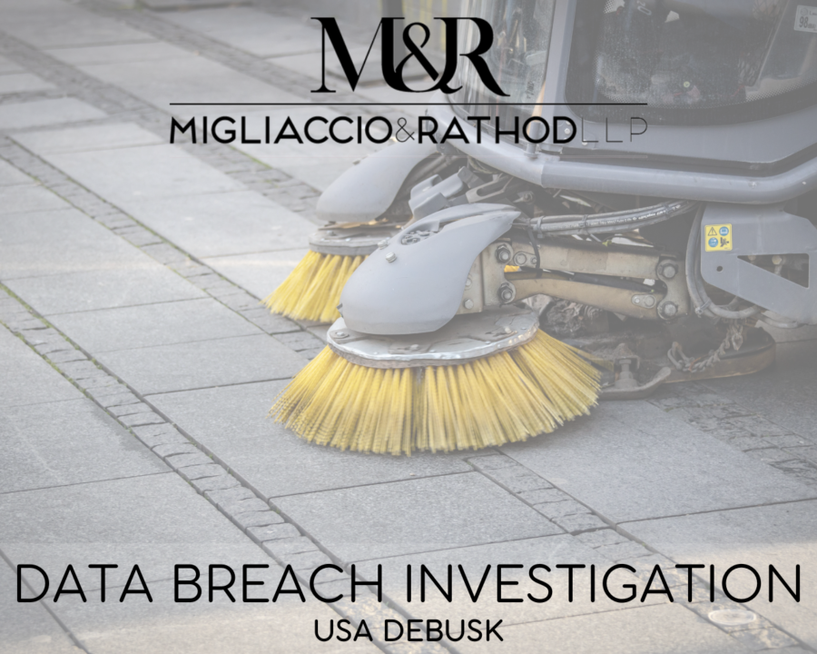 Graphic announcing the USA DeBusk data breach investigation featuring the Migliaccio & Rathod LLP logo and a background image of a cleaning machine.