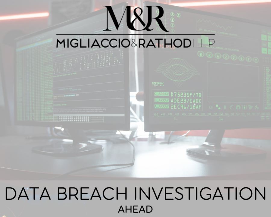 Graphic announcing the AHEAD data breach investigation, featuring the Migliaccio & Rathod LLP logo and a background image of two computer monitors with green coding text on the screens.